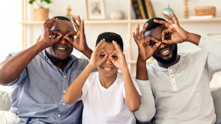 Three generations of joy as family poses playfully indoors at homeの写真素材