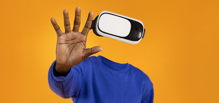 Engaging with virtual reality technology through a modern headsetの写真素材