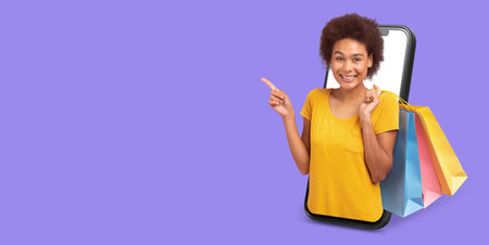 Customer enjoys online shopping with smartphone and shopping bagsの写真素材