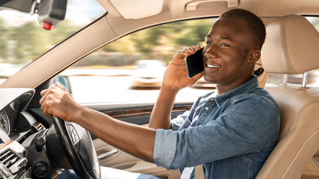 Cheerful afro american man driver having phone conversation