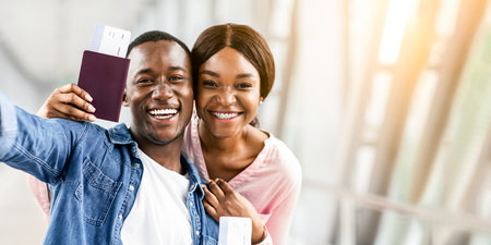 Memorable Trip. Happy Black Couple Capturing Selfie Photo At Airport Terminalの写真素材