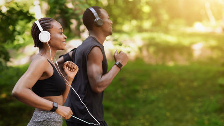 Morning Run Concept. Sporty Black Man And Woman Jogging Outdoor In Parkの写真素材