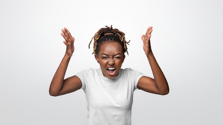 Young black girl screaming and gesturingの写真素材