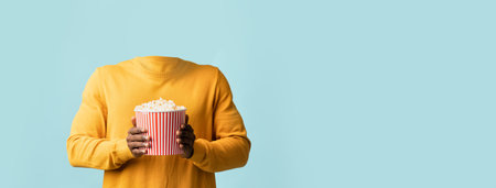 Bright collage of a person with popcornの写真素材