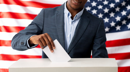 Voter pulls vote ballot. USA flag on backgroundの写真素材
