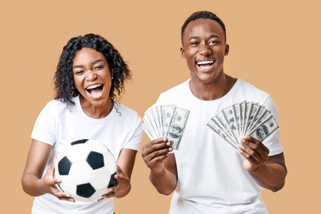 Excited african-american couple enjoying sport bet winの写真素材