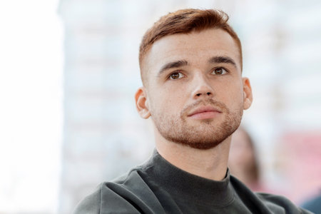 Closeup of caucasian guy leader guiding international group of protestors