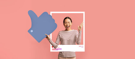 Social media influencer celebrating with thumbs up and engaging backgroundの写真素材