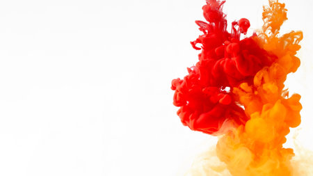 Colored ink in water creating abstract shape, isolated on white backgroundの写真素材