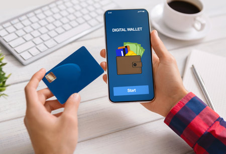 Man using smartphone with digital wallet application and credit cardの写真素材