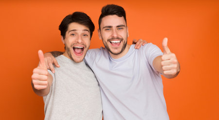 We recommend! Happy men showing thumbs up