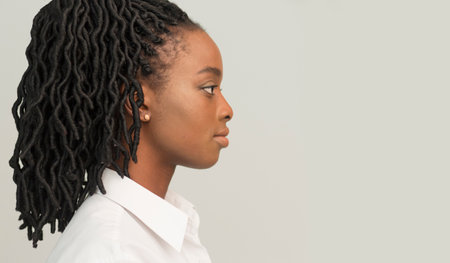 Profile Portrait Of Black Businesswoman, Studio Shot
