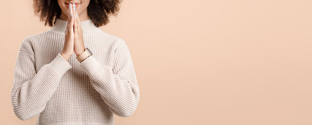 Meditation, asking or desire. Calm teen african american woman folded her hands