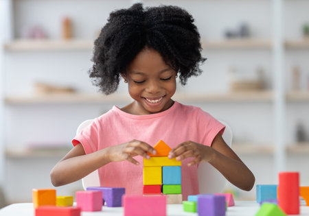 Little child playing with colorful wooden blocksの写真素材