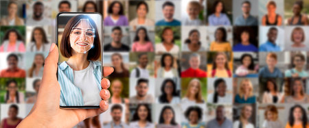 Facial recognition technology in use on modern smartphone for identificationの写真素材
