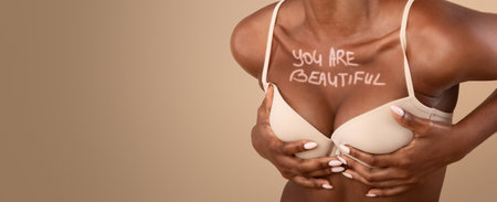 Happy Black Woman In Bra With You Are Beautiful Inscription On Chestの写真素材