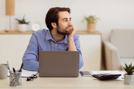 Bored Businessman Sitting At Laptop Looking Aside Procrastinating In Office