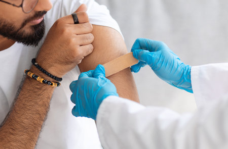 Cropped of arab man getting shot injection against coronavirus