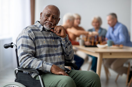 Disabled african american senior man in wheelchair feeling lonely
