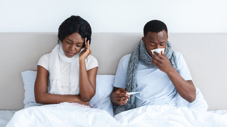 Black family got coronavirus, staying in bed at homeの写真素材