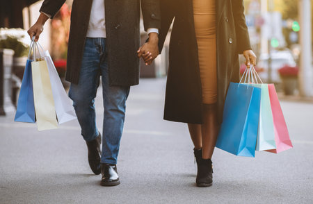 Couple bought a lot of shopping during black fridayの写真素材