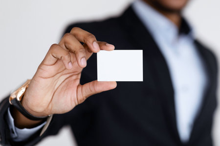 Empty card in african american man hands, selective focusの写真素材