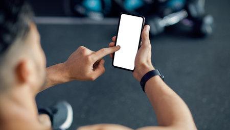 Unrecognizable Male Using Cellphone With White Screen At Gym, Mockupの写真素材