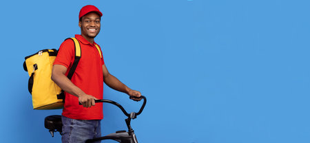Smiling delivery delivery man riding bicycle at studio