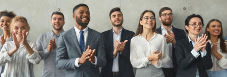 Happy business team applauding after successful meetingの写真素材