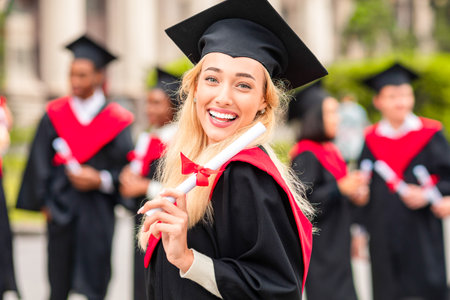 Cute blonde lady student having graduation partyの写真素材