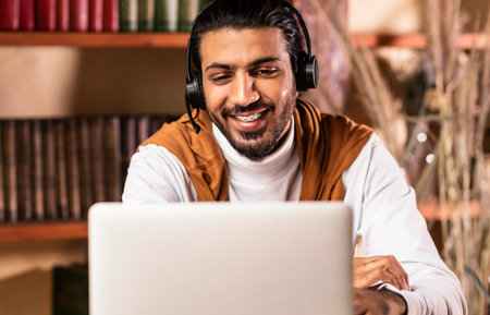 Teacher Having Online Class Making Video Call Via Laptop Indoorの写真素材