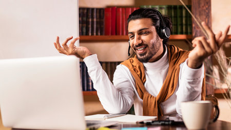 Teacher Having Virtual Lesson Via Video Call At Laptop Indoorの写真素材