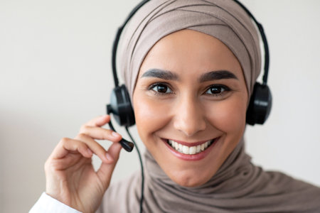 Closeup portrait of cheerful female doctor with headsetの写真素材
