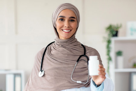Female doctor holding medicine, recommending supplements while pandemicの写真素材