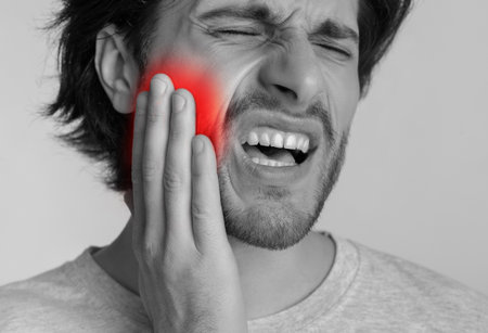 Tooth pain and dentistry concept. Man with painful expressionの写真素材
