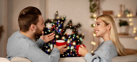 Couple in love spending xmas eve together at homeの写真素材