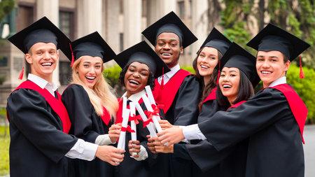 Diverse International Students With Diplomas Celebrating Graduationの写真素材