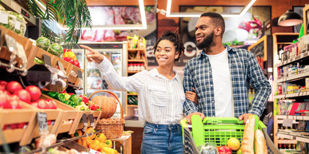 Family On Grocery Shopping In Supermarket Buying Vegetabels And Fruits