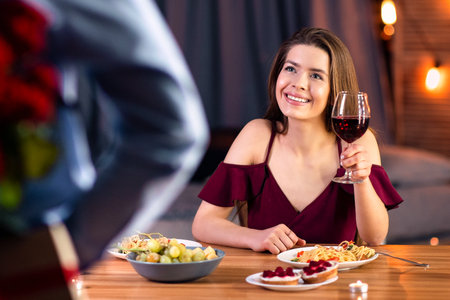 Affectionate Man Prepared Romantic Surprise For His Girlfriend, Holding Roses And Giftの写真素材