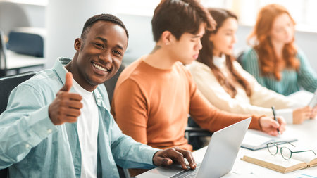 Group of international people using laptops in coworkingの写真素材