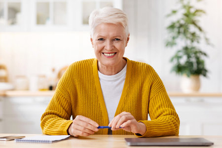 Happy senior woman getting ready before webinar
