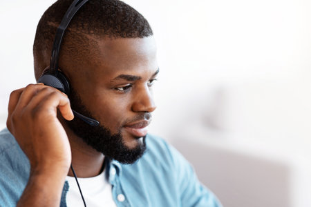 Closeup Portrait Of Young Handsome African American Man In Headsetの写真素材