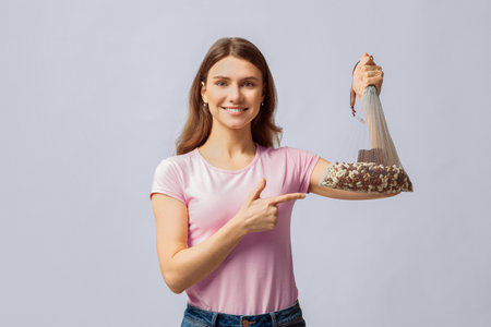 Eco Storage Concept. Smiling Young Lady Holding Reusable Mesh Bag With Beansの写真素材