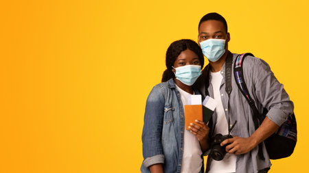 Coronavirus And Tourism. African Couple In Medical Masks With Passports In Hands