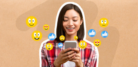 Young woman smiles while chatting on smartphone surrounded by emoticons