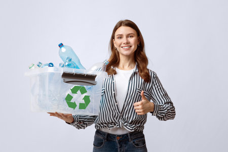 Positive Eco-Friendly Woman Holding Container With Plastic Bottles And Showing Thumb Up