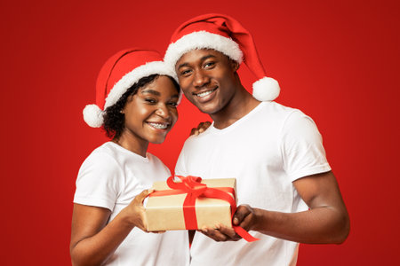 Cheerful african american couple celebrating New Year togetherの写真素材