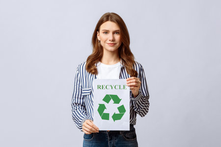 Millennial Eco-Activist Lady Showing Placard With Green Recycle Sign Iconの写真素材