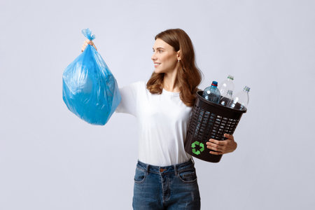 Waste Sorting. Positive Lady Holding Bag With Garbage And Plastic Bottles Bucketの写真素材
