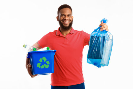 Man Holding Box With Litter And Garbage Bag, White Backgroundの写真素材